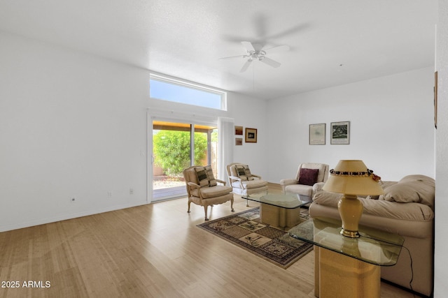 11775 E Becker Ln, Scottsdale, AZ 85259 - living room featuring ceiling fan, light wood-style floors, and baseboards