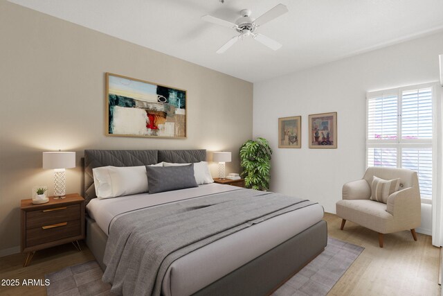 11775 E Becker Ln, Scottsdale, AZ 85259 - bedroom with light wood-type flooring, a ceiling fan, and baseboards