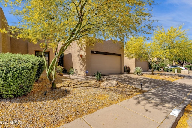 11775 E Becker Ln, Scottsdale, AZ 85259 - adobe home featuring concrete driveway and stucco siding