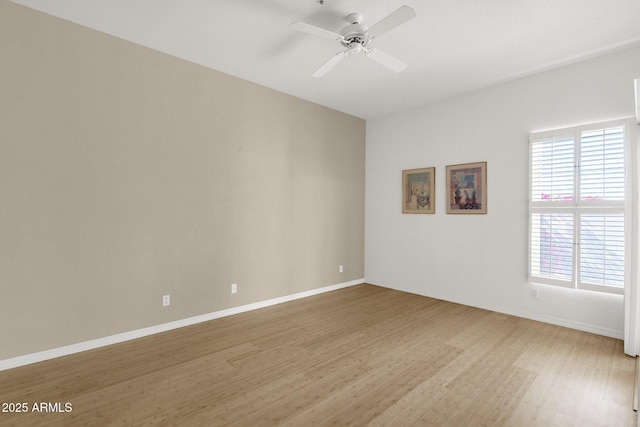 11775 E Becker Ln, Scottsdale, AZ 85259 - unfurnished room featuring light wood finished floors, healthy amount of natural light, baseboards, and ceiling fan