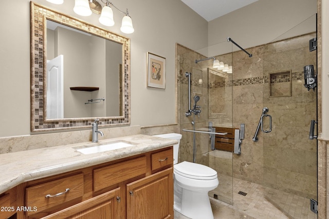 11775 E Becker Ln, Scottsdale, AZ 85259 - full bath with vanity, a shower stall, toilet, and tile walls