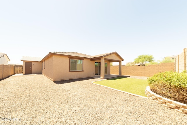 back of house featuring a patio area