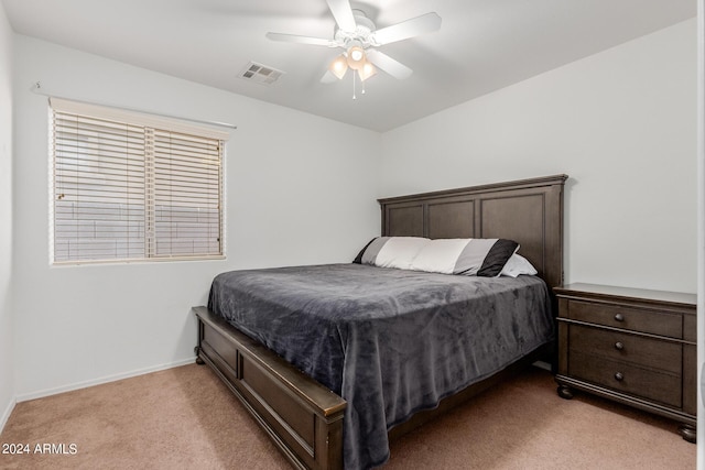 bedroom with light carpet and ceiling fan