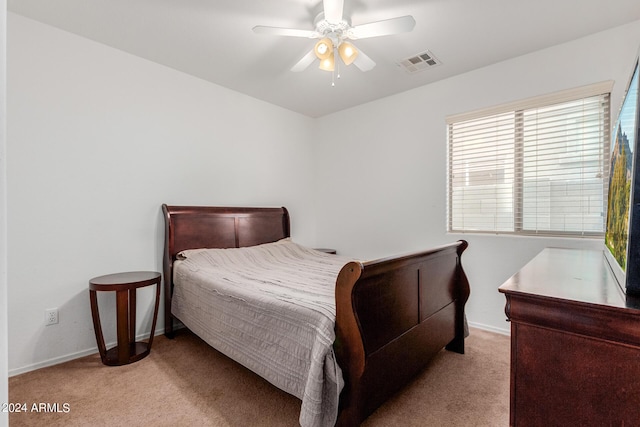 bedroom featuring light colored carpet and ceiling fan