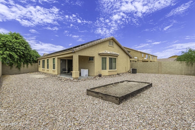 rear view of property featuring a patio area and central AC unit