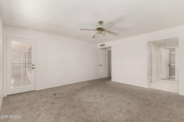 9857 W Tonto Ln, Peoria, AZ 85382 - empty room featuring light carpet, a ceiling fan, and a textured ceiling
