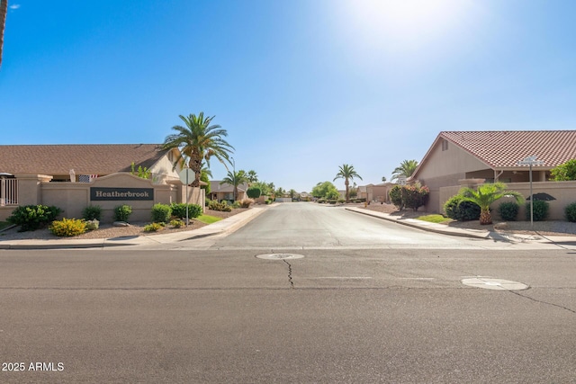 9857 W Tonto Ln, Peoria, AZ 85382 - view of asphalt street featuring sidewalks, curbs, and a residential view