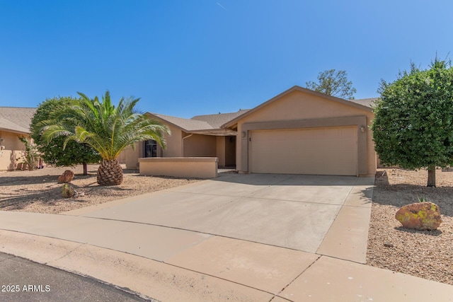 9857 W Tonto Ln, Peoria, AZ 85382 - view of front of house featuring stucco siding, a garage, and concrete driveway