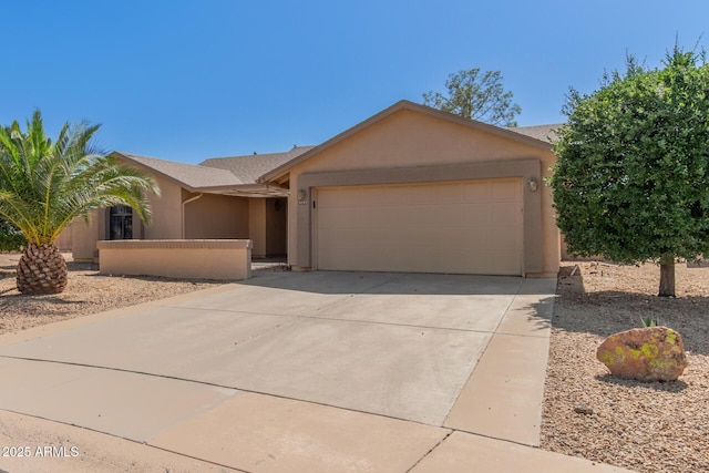 9857 W Tonto Ln, Peoria, AZ 85382 - ranch-style house with stucco siding, a garage, and driveway