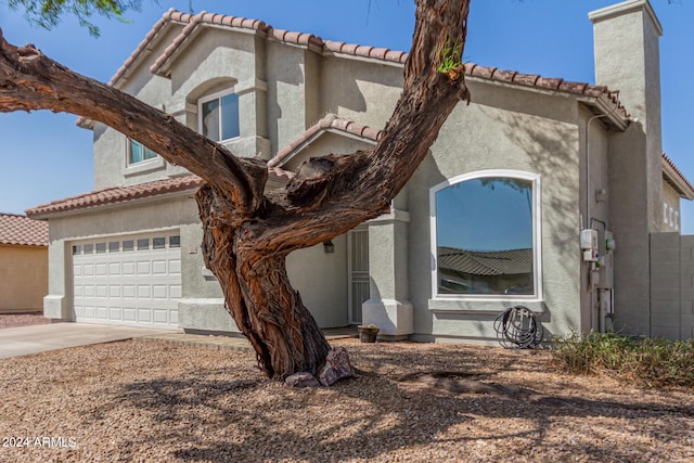 mediterranean / spanish-style home featuring a garage