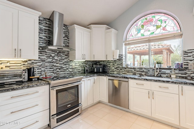 901 W Beck Ln, Phoenix, AZ 85023 - kitchen with tasteful backsplash, stainless steel appliances, a sink, wall chimney range hood, and white cabinets