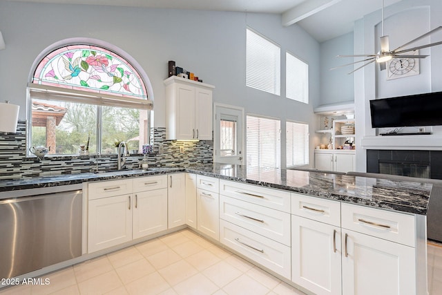 901 W Beck Ln, Phoenix, AZ 85023 - kitchen featuring dark stone countertops, ceiling fan, dishwasher, and a peninsula