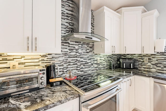 901 W Beck Ln, Phoenix, AZ 85023 - kitchen featuring wall chimney range hood, white cabinetry, and appliances with stainless steel finishes