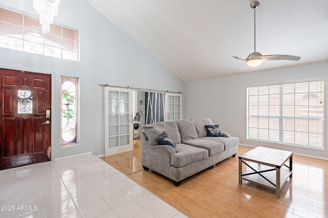 901 W Beck Ln, Phoenix, AZ 85023 - living room featuring high vaulted ceiling, ceiling fan with notable chandelier, and light tile patterned flooring