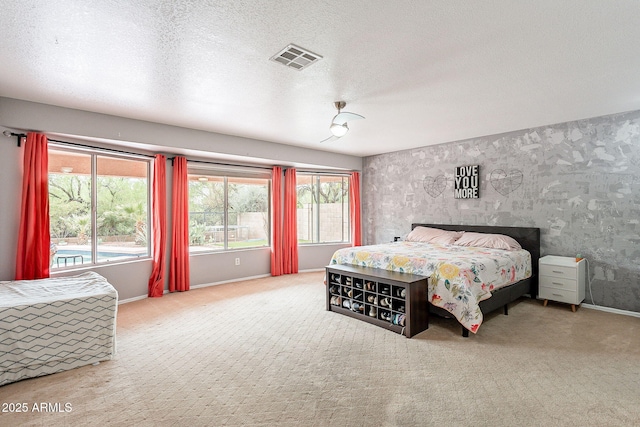 901 W Beck Ln, Phoenix, AZ 85023 - bedroom with baseboards, visible vents, wallpapered walls, and a textured ceiling