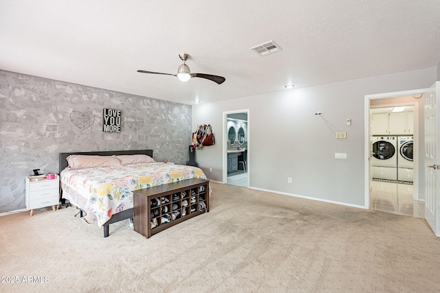 901 W Beck Ln, Phoenix, AZ 85023 - bedroom with washer and clothes dryer, carpet flooring, a textured ceiling, baseboards, and visible vents