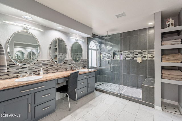 901 W Beck Ln, Phoenix, AZ 85023 - bathroom featuring visible vents, marble finish floor, double vanity, a sink, and a walk in shower