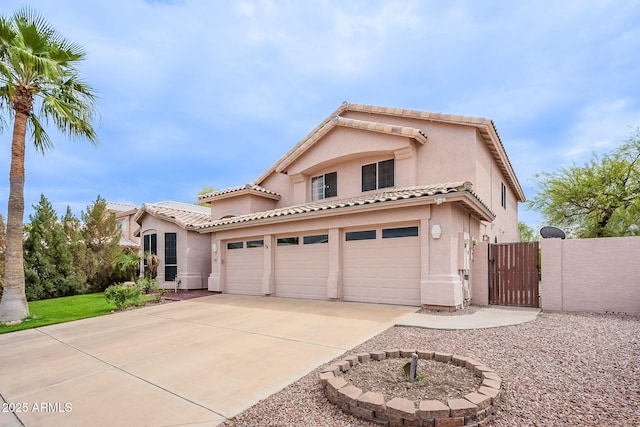 901 W Beck Ln, Phoenix, AZ 85023 - mediterranean / spanish house with a tile roof, a gate, concrete driveway, and stucco siding