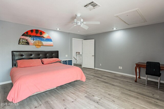 901 W Beck Ln, Phoenix, AZ 85023 - bedroom featuring attic access, baseboards, visible vents, and wood finished floors