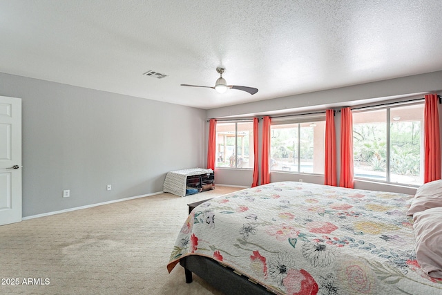 901 W Beck Ln, Phoenix, AZ 85023 - bedroom with a textured ceiling, visible vents, carpet, baseboards, and a ceiling fan