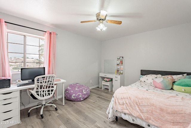 901 W Beck Ln, Phoenix, AZ 85023 - bedroom featuring baseboards, ceiling fan, and light wood-type flooring