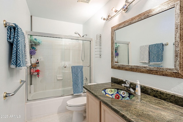 901 W Beck Ln, Phoenix, AZ 85023 - full bath with visible vents, toilet, vanity, enclosed tub / shower combo, and tile patterned flooring