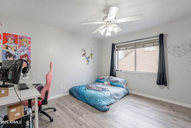 901 W Beck Ln, Phoenix, AZ 85023 - bedroom with baseboards, light wood-type flooring, and a ceiling fan