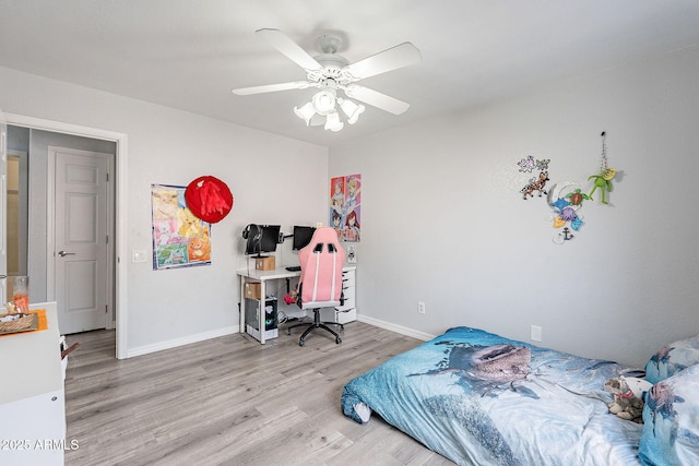 901 W Beck Ln, Phoenix, AZ 85023 - bedroom featuring baseboards, wood finished floors, and a ceiling fan