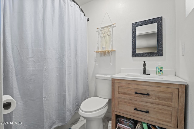 bathroom with vanity, toilet, and a shower with shower curtain