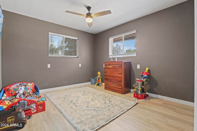 bedroom featuring ceiling fan and hardwood / wood-style flooring