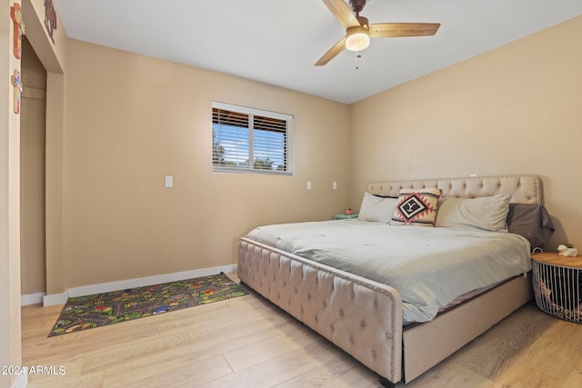 bedroom with ceiling fan and light wood-type flooring