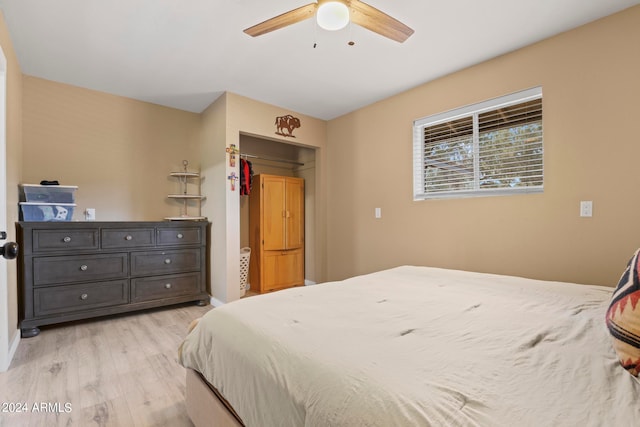 bedroom with light hardwood / wood-style floors and ceiling fan