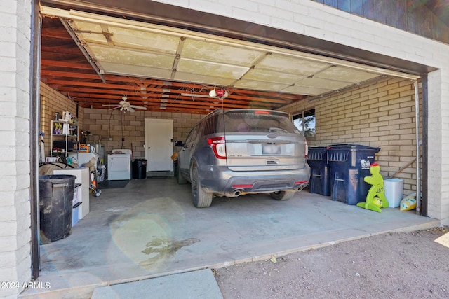 garage featuring separate washer and dryer and a carport