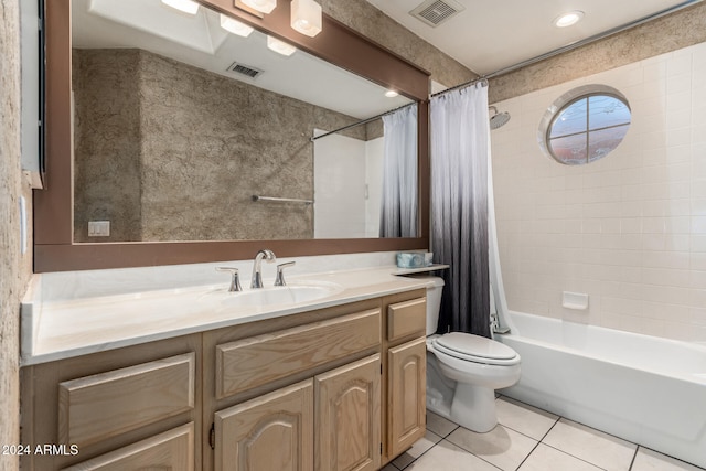 full bathroom featuring toilet, vanity, tile patterned floors, and shower / bathtub combination with curtain