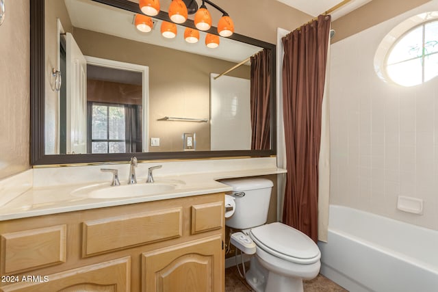 full bathroom featuring toilet, shower / tub combo, and vanity