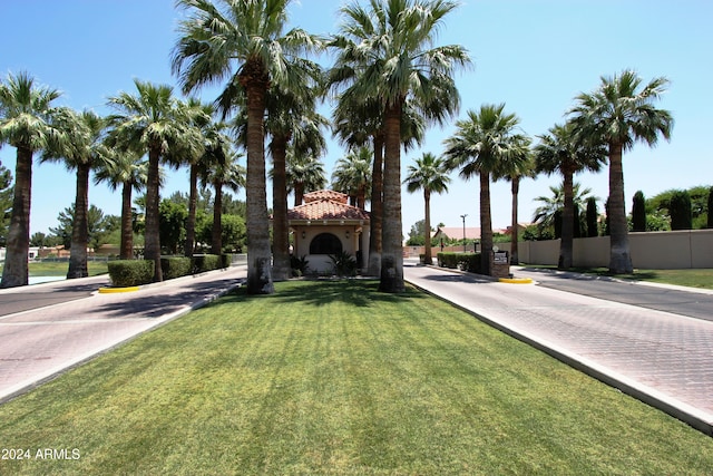 view of front of home with a front lawn and a gazebo