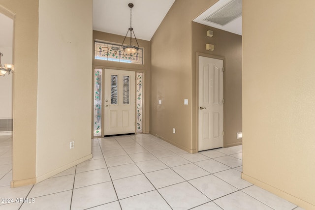 foyer entrance featuring lofted ceiling and light tile patterned floors