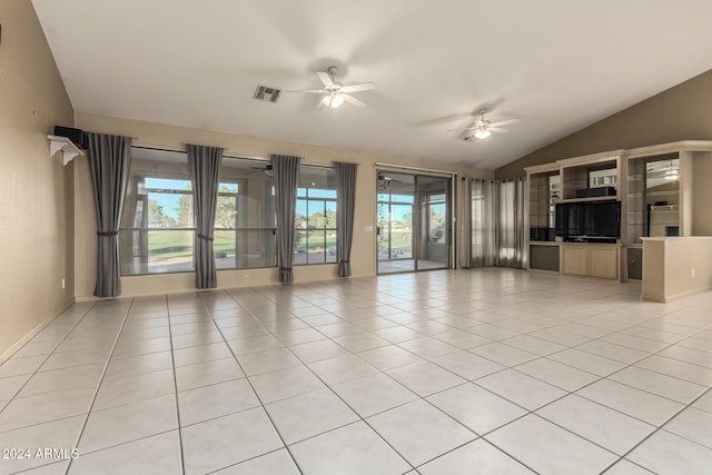 unfurnished living room with ceiling fan, light tile patterned floors, and vaulted ceiling