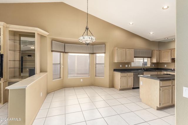 kitchen featuring decorative light fixtures, light brown cabinetry, sink, dishwasher, and a center island