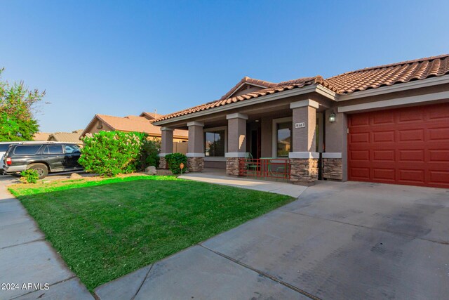 view of front of home featuring a garage and a porch