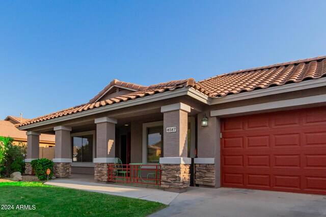 property entrance featuring a patio area and covered porch