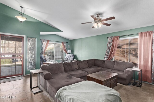 living room featuring vaulted ceiling and ceiling fan