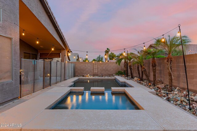 back of property featuring an outdoor fire pit, a yard, central AC unit, and a patio area