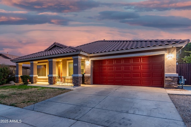 view of front of home with a garage and covered porch