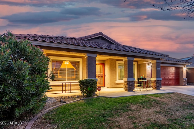 view of front of property featuring a porch and a garage