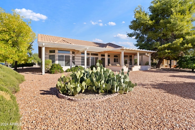 back of property with a patio