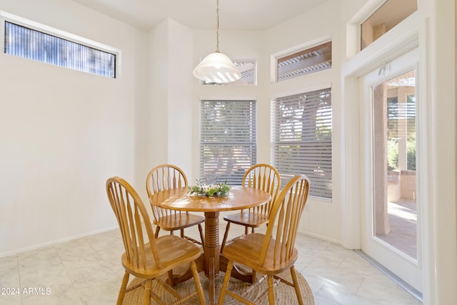 dining space featuring light tile patterned floors