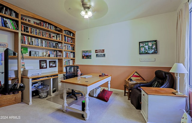 carpeted home office with ceiling fan