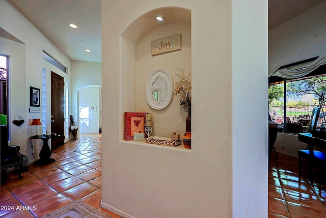 hall featuring tile patterned flooring