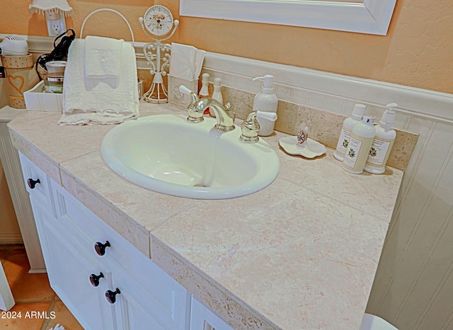 bathroom featuring vanity and tile patterned flooring